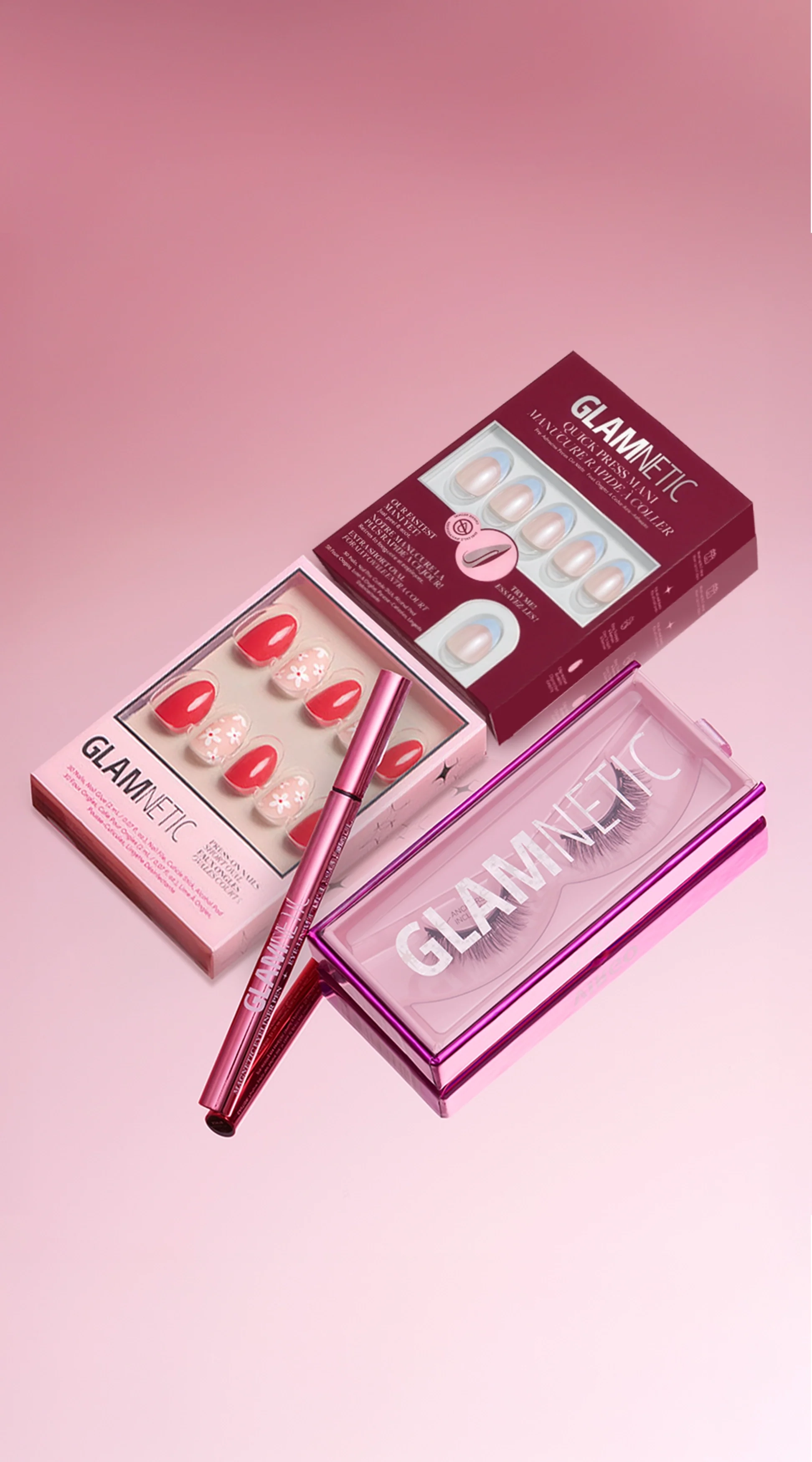 Glamnetic press-on nail boxes, a Quick Press Mani box, a magnetic liner and a magnetic lash case on a pink background
